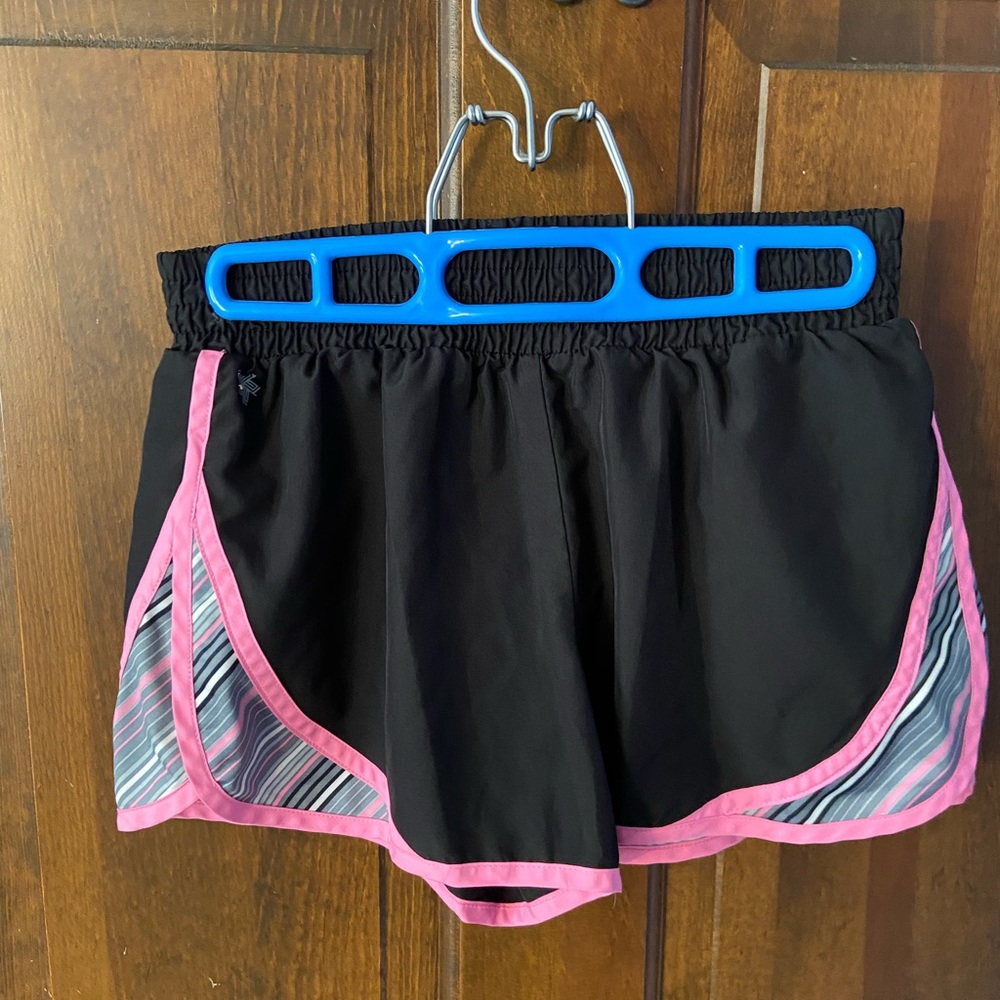 Pair of junior shorts. Size XS. Brand is Tek Gear